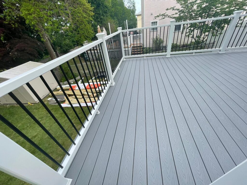 Decking and Railings Installation: Lay composite planks with precise gapping for drainage, then add railings and steps for a finished, secure structure.